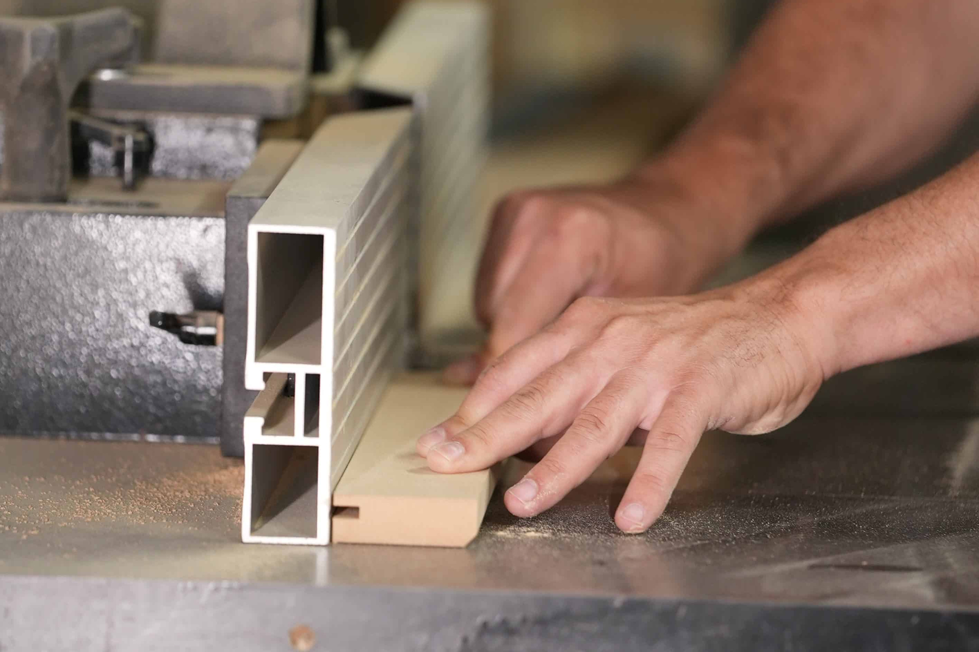 Technician cutting wood